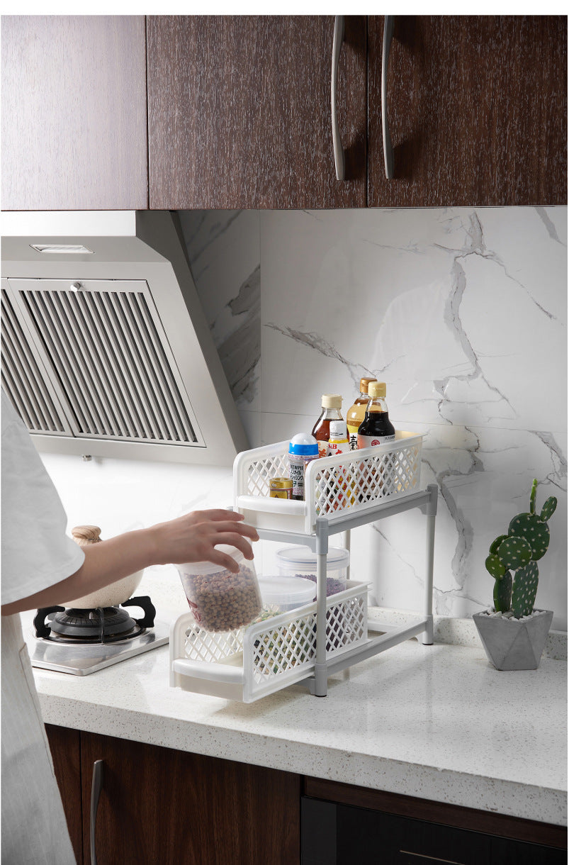 Two-tier sliding cabinet organizer used on a kitchen countertop
