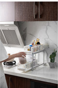 Two-tier sliding cabinet organizer used on a kitchen countertop